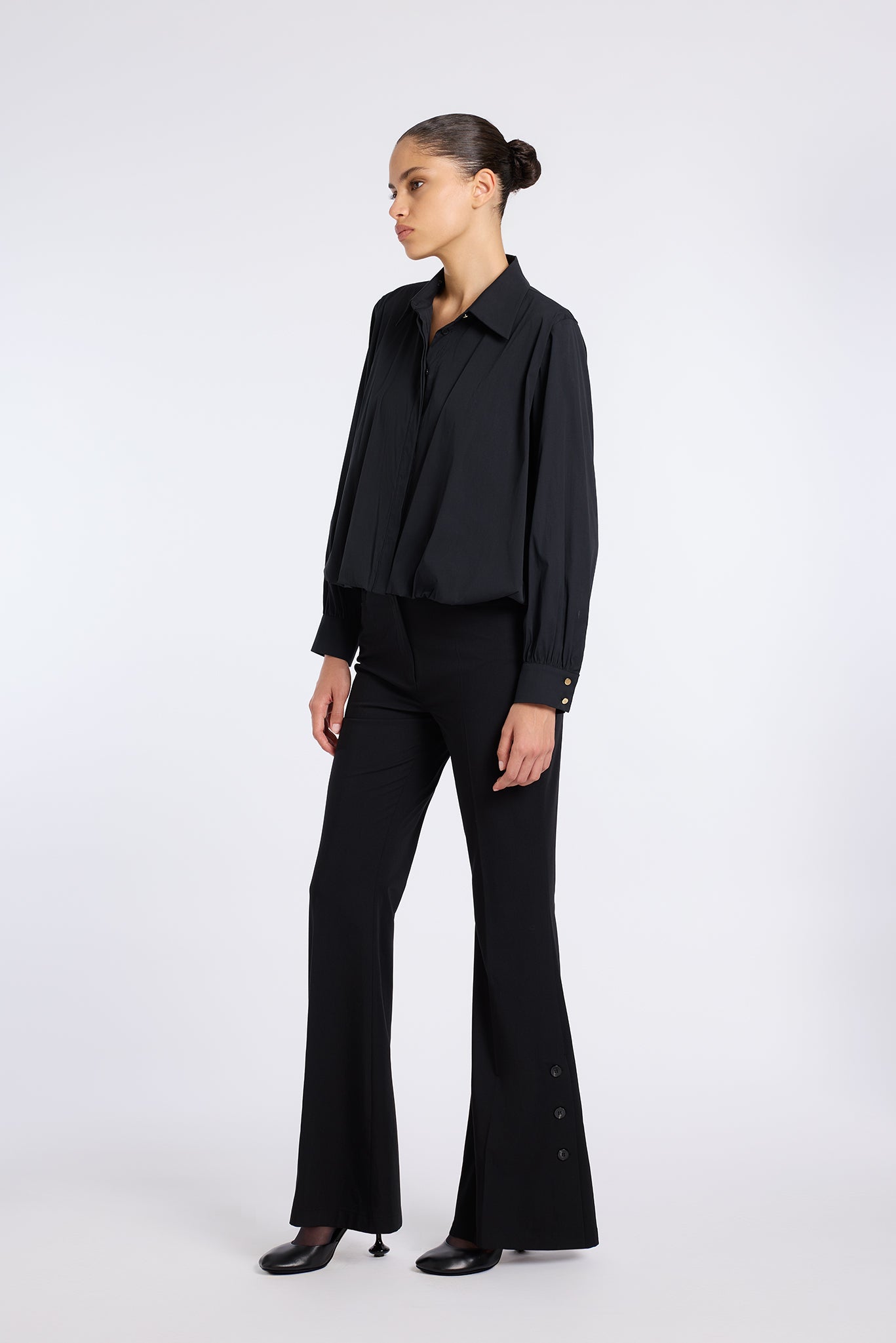 FLARED BLACK PANTS WITH BUTTON DETAIL